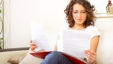 businesswoman at home doing paperwork
